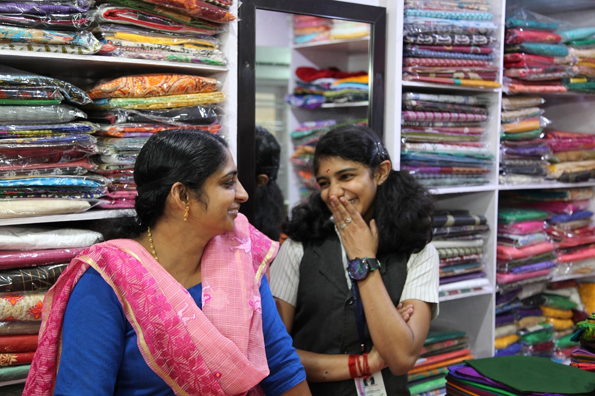 Sajitha (left) and her daughter, Swati (right), at the shop. ©2018 World Vision, Namitha Lizbeth.