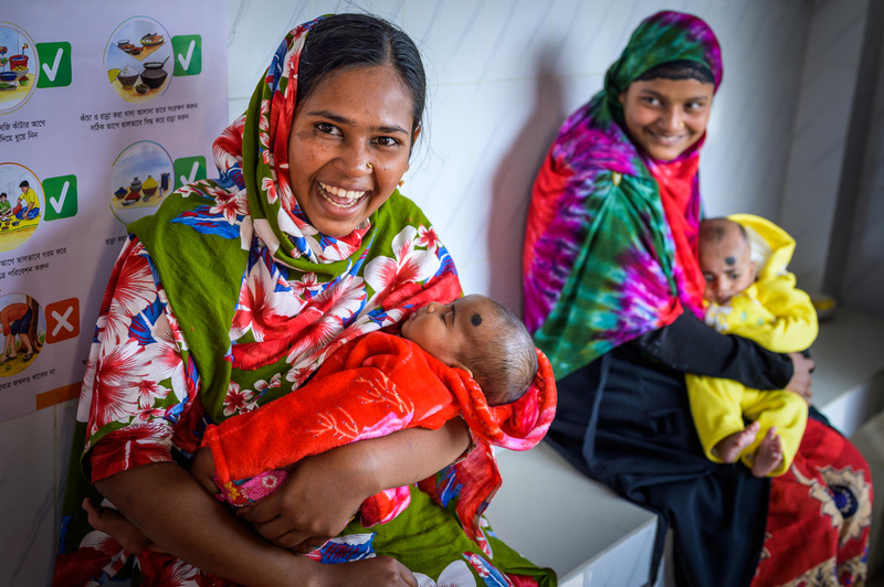 Mothers in Bangladesh hold their new babies