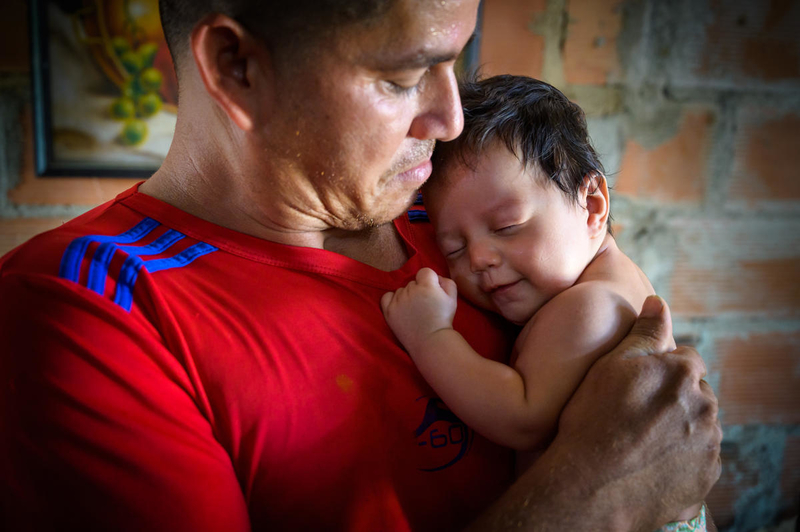 Baby girl with her father in Venezuela. 