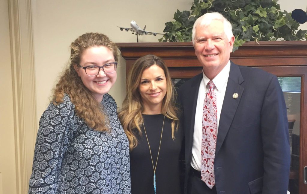Volunteer combines prayer and action by meeting with representative.
