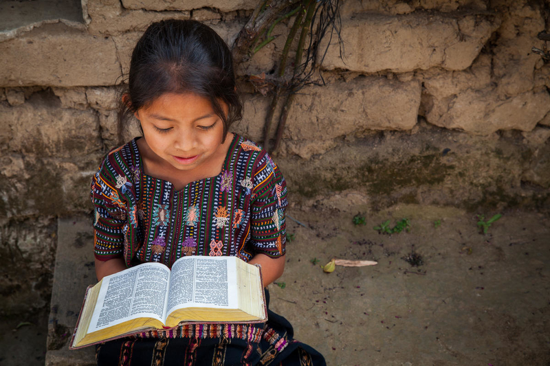 Girl reading Bible in Guatemala