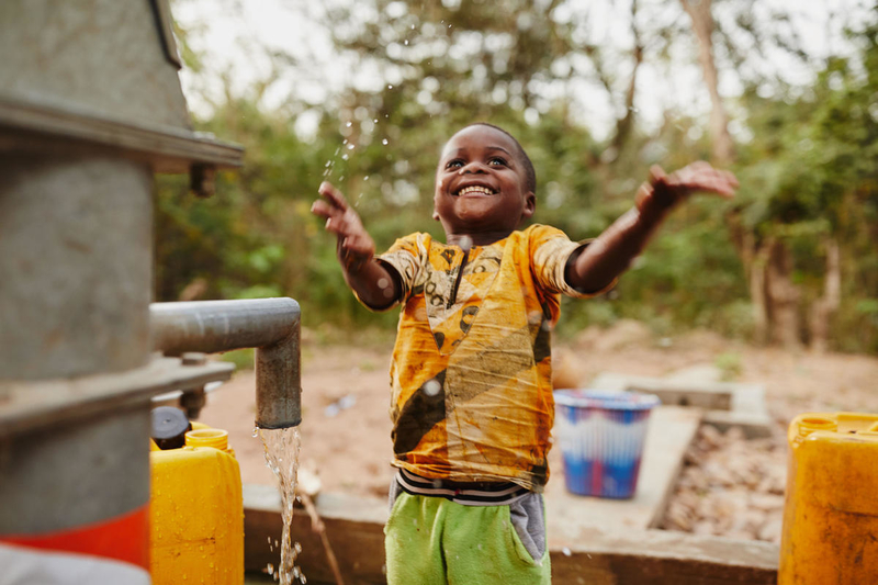 Boy celebrating clean water