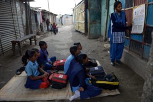 In a community in India, child protection efforts are being made to stop trafficking, stop child marriage, and ensure education for children.