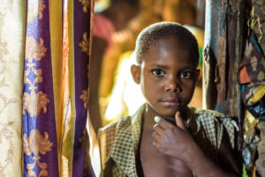 Three of Josephine’s daughters died of HIV and AIDS. Now she cares for their children at her home in Uganda, plus another orphan named Elizabeth, pictured. ©2016 World Vision, Jon Warren.