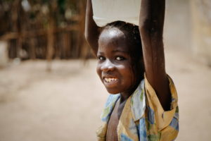This young girl is from Tonguia, in the south of Senegal. Poverty and cultural and religious customs expose children to issues such as begging, early marriage and pregnancy, female genital mutilation, child labour and trafficking and lack of official birth documentation. This is why World Vision, partners with local government, other agencies as well as community and religious leaders to engage in greater child protection. ©2018 World Vision /Jeff Arnold