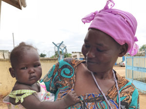 Susan John, 27, a mother of 3 children brought her children to the Kator Primary Health Center where World Vision Nutrition team does screening and measurement of children registered in the program. With her is 8-months old daughter Amal who got malaria when she was 6-months old.