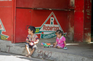 Two Salvadoran children play in a neighborhood where gang violence is prevalent. Photo credit: ©2012 World Vision, Heidi Isaza ﻿