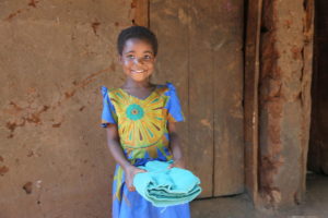 Thanks to corroborated efforts by World Vision, the Malawi Government and the Global Fund, Ellena and her family are one piece of a bigger and happier story of triumph. She received three sets of soft, billowing, green mosquito nets, treated with an insecticide that will remain potent for a decade. ©World Vision 2019, Charles Kabena.