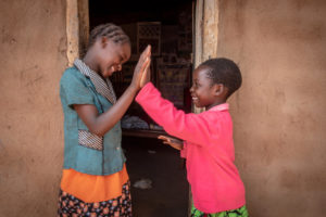 Two friends give high-five