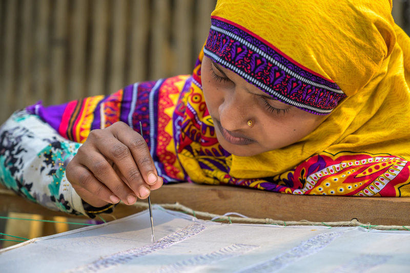 Moms in Bangladesh learn embroidery to raise income