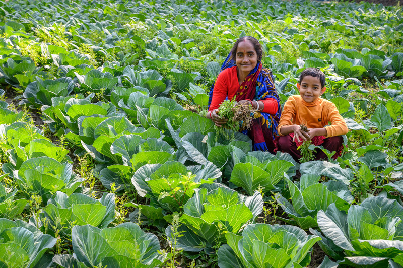 Sobita and her daughter in field. 