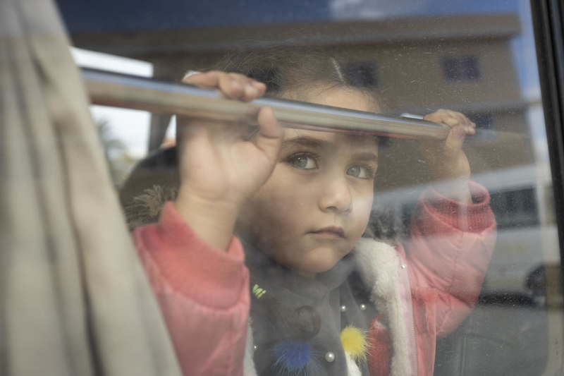 Refugee girl on school bus