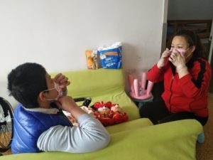 Boy learns to wear mask