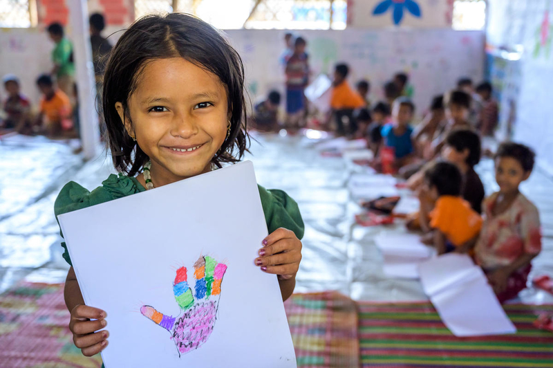 Refugee girl enjoys drawing