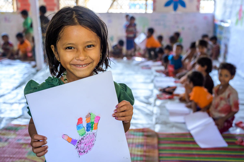 Refugee girl enjoys drawing 