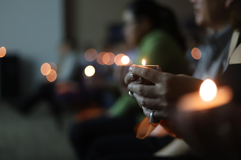 Holding prayer candles