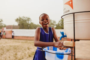 girl washes her hands