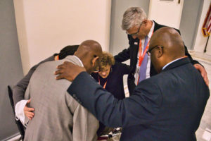 leaders pray together