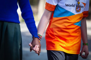 two girls holding hands