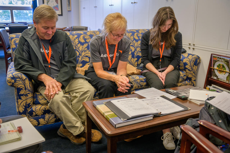 World Vision Advocates pray with government leaders. 